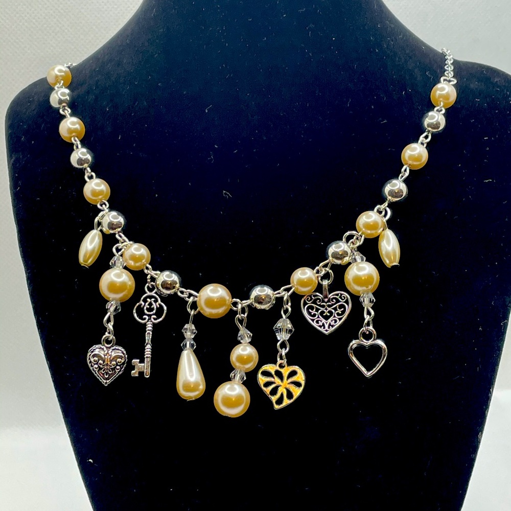 Pearl necklace with charms